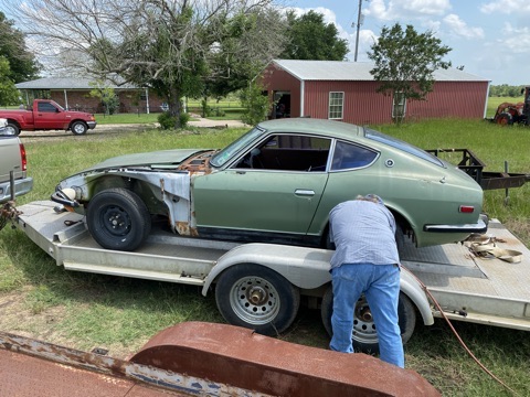 Driver’s side of the 240Z on its trailer with front panels removed