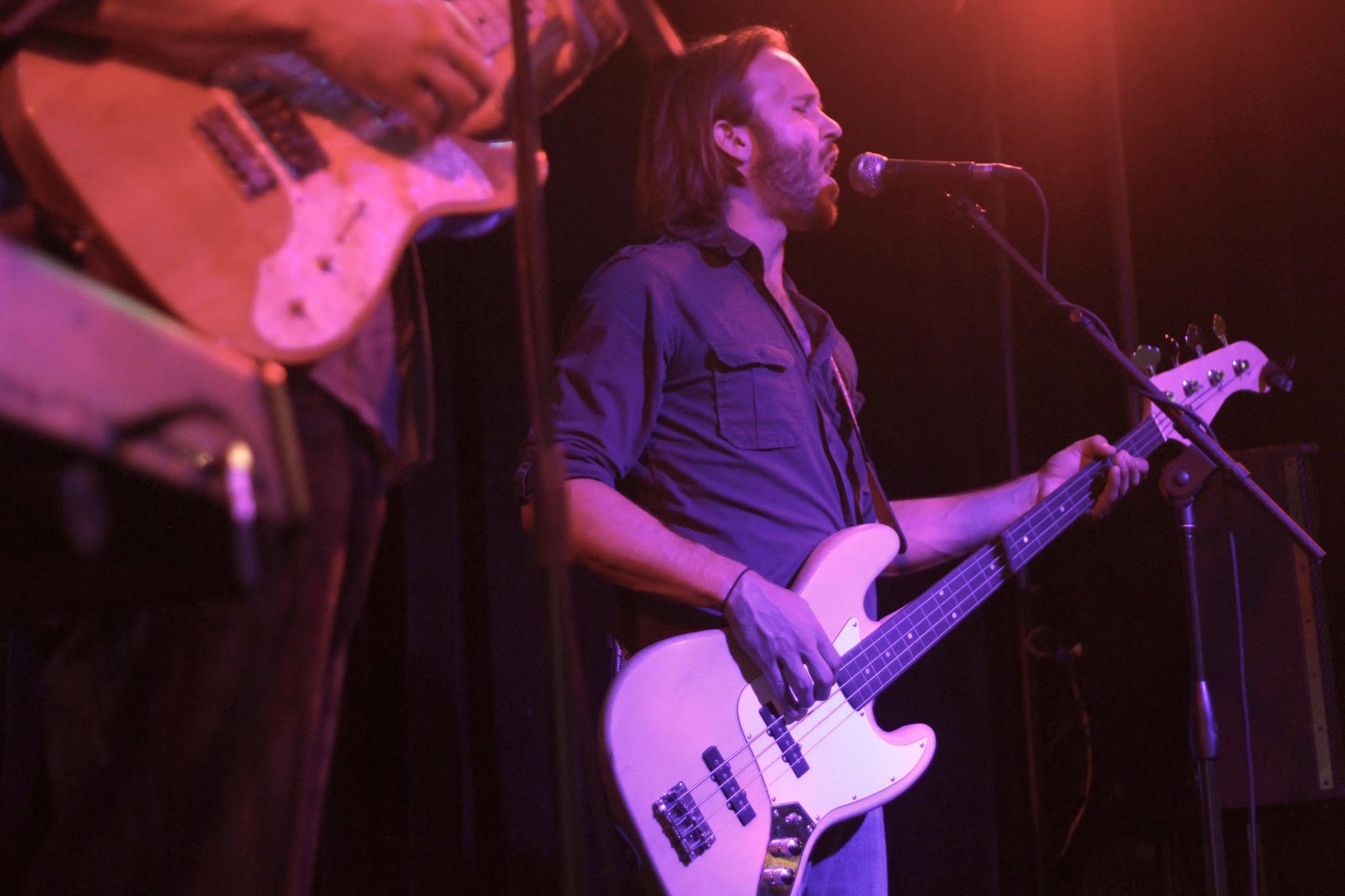 Quinn Walton singing and playing bass with Big Ol' Band