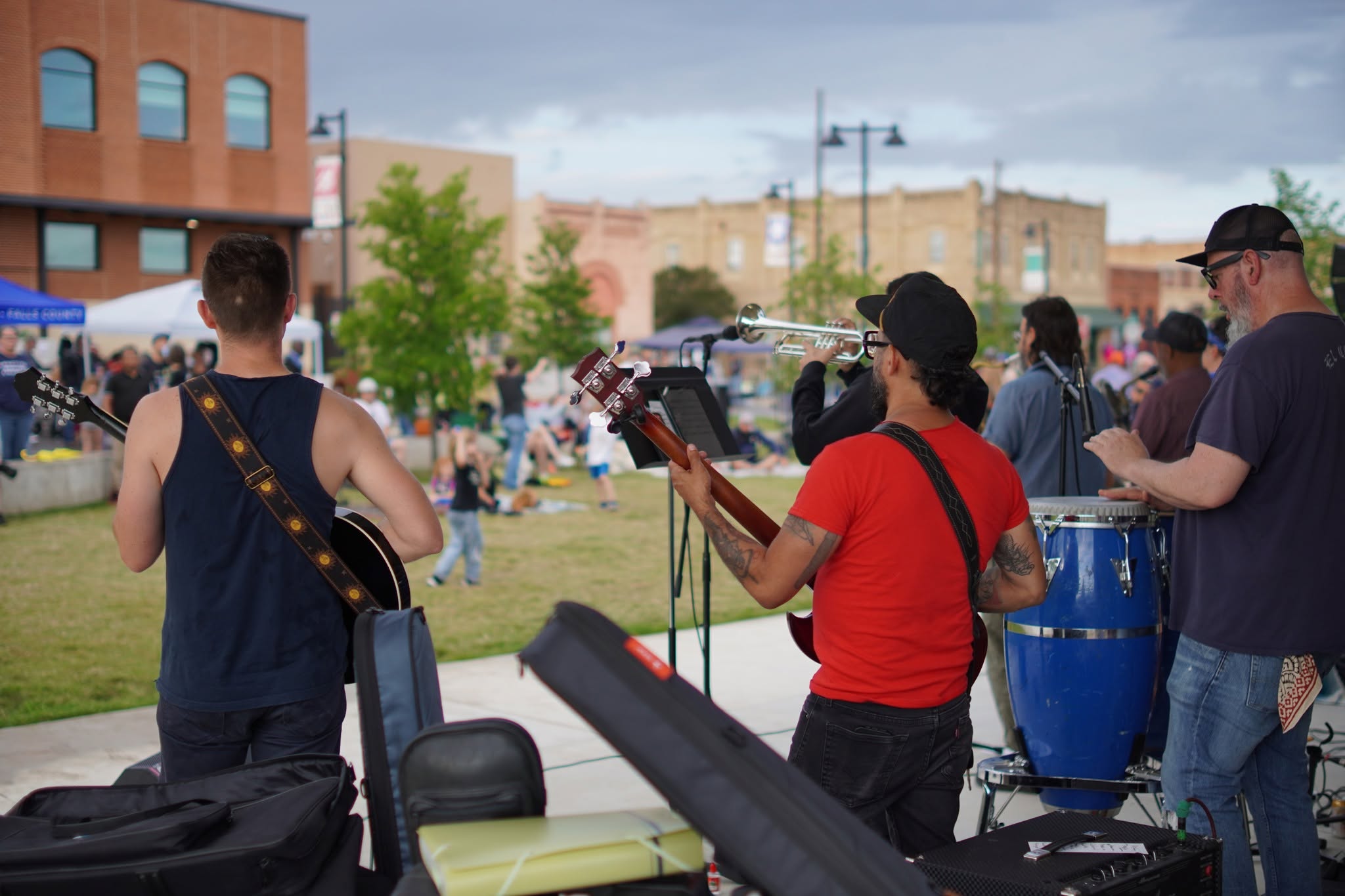Musicians facing downtown Elgin and the festival audience