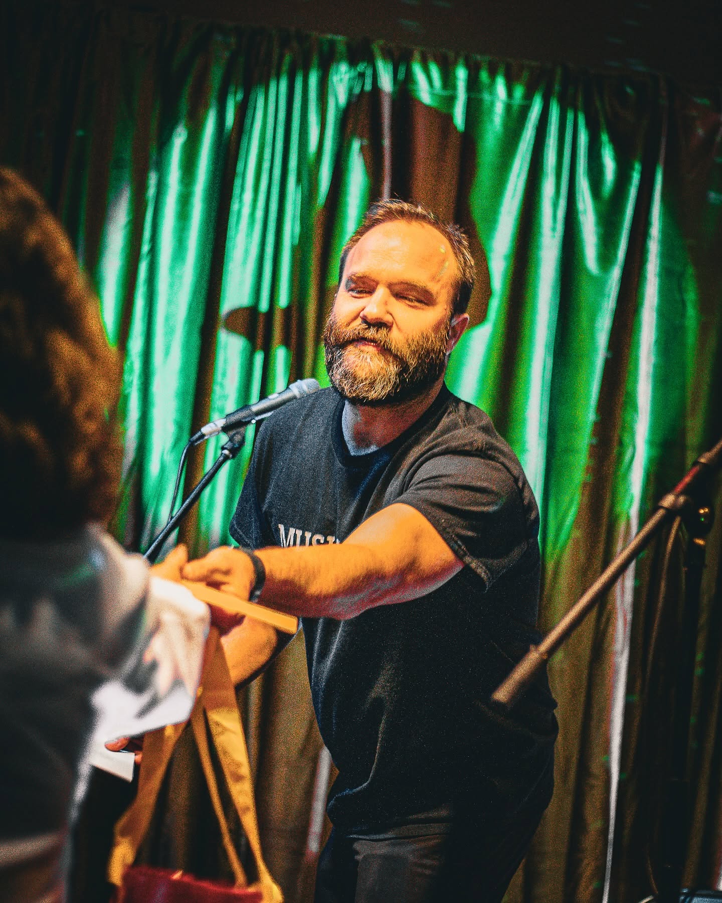 Quinn Walton greeting a guest at an Elgin Music Festival fundraiser