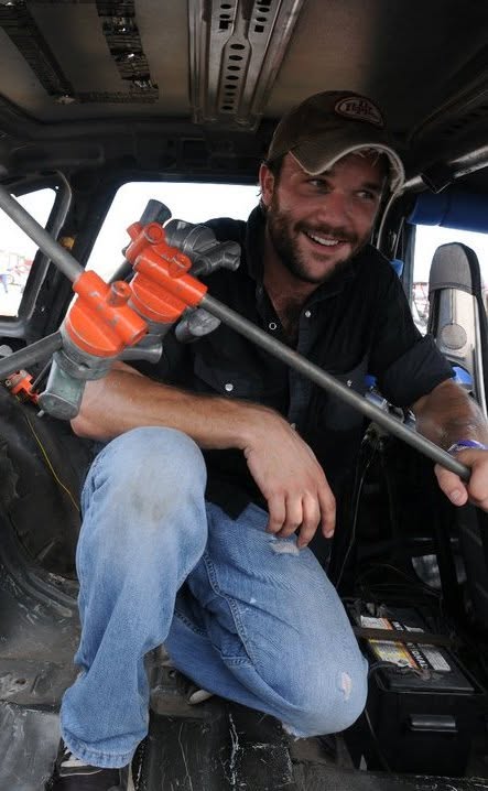 Quinn Walton filming inside a stock car